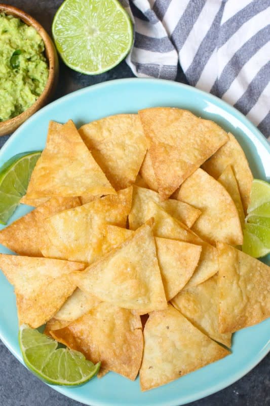 <p>Izzy Cooking</p><p>The best ever super crispy and crunchy air fryer tortilla chips without oil! You’ll only need three ingredients and a few minutes!</p><p><strong>Get the recipe: <a href="https://izzycooking.com/air-fryer-tortilla-chips/" rel="nofollow noopener" target="_blank" data-ylk="slk:Air Fryer Tortilla Chips;elm:context_link;itc:0;sec:content-canvas" class="link ">Air Fryer Tortilla Chips</a></strong></p>