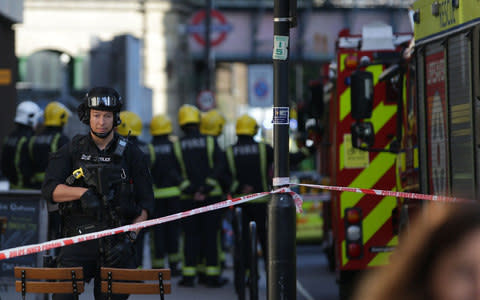 A firearms officer at the police cordon in west London - Credit: DANIEL LEAL-OLIVAS/AFP