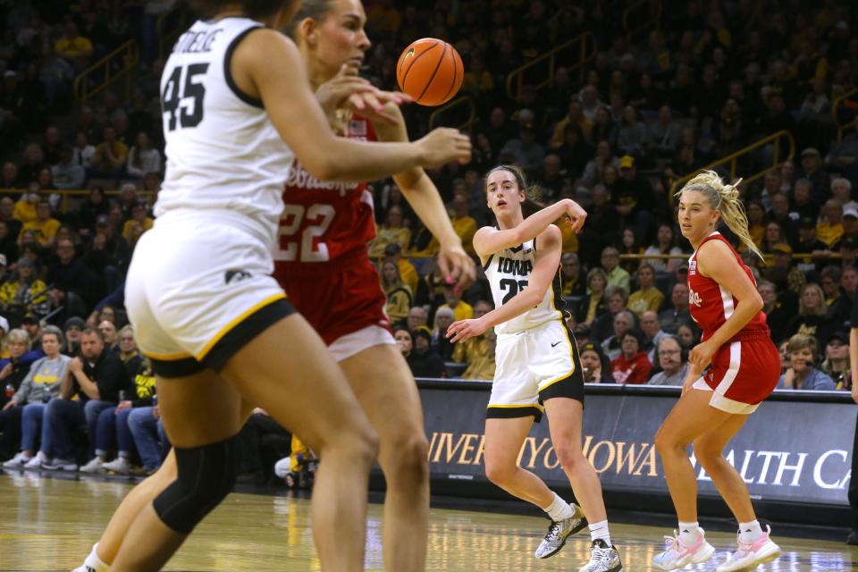 Iowa's Caitlin Clark leads the nation in scoring (32.1 points per game) and assists (7.7 per game) this season.