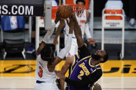 Los Angeles Lakers center Andre Drummond (2) blocks a shot by New York Knicks center Nerlens Noel (3) during the third quarter of a basketball game Tuesday, May 11, 2021, in Los Angeles. (AP Photo/Ashley Landis)