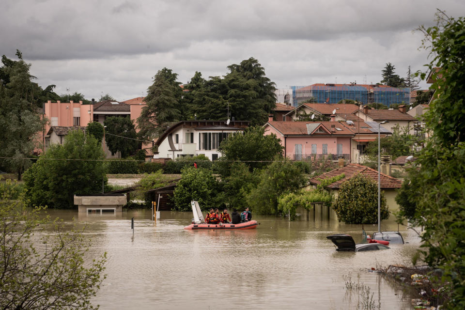 Rescue workers help residents during the flooding in Cesena on May 17.<span class="copyright">IPA/Sipa USA/Reuters</span>