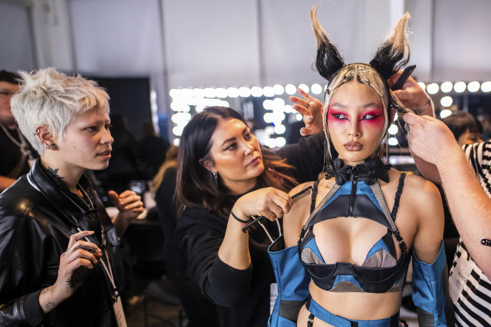 A model is prepped backstage before the Namilia fashion show at Pier 59 Studios during NYFW Fall/Winter 2020 on Sunday, Feb. 9, 2020, in New York. (Photo by Charles Sykes/Invision/AP)