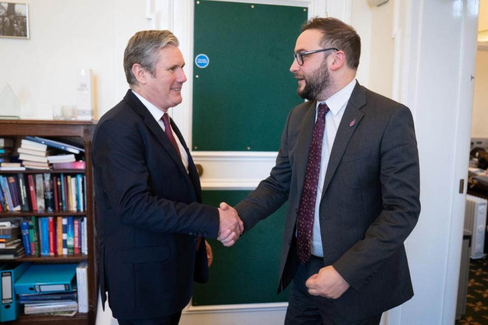 Sir Keir Starmer shakes hands with Bury South MP Christian Wakeford after his defection from the Conservatives to Labour (Stefan Rousseau/PA) (PA Wire)