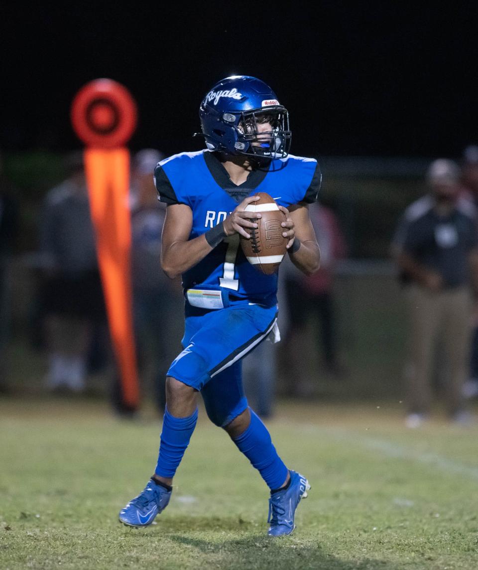 Quarterback Hayden Morris (1) looks for an open receiver during the Northview vs Jay football game at Jay High School in Jay on Friday, Oct. 14, 2022.