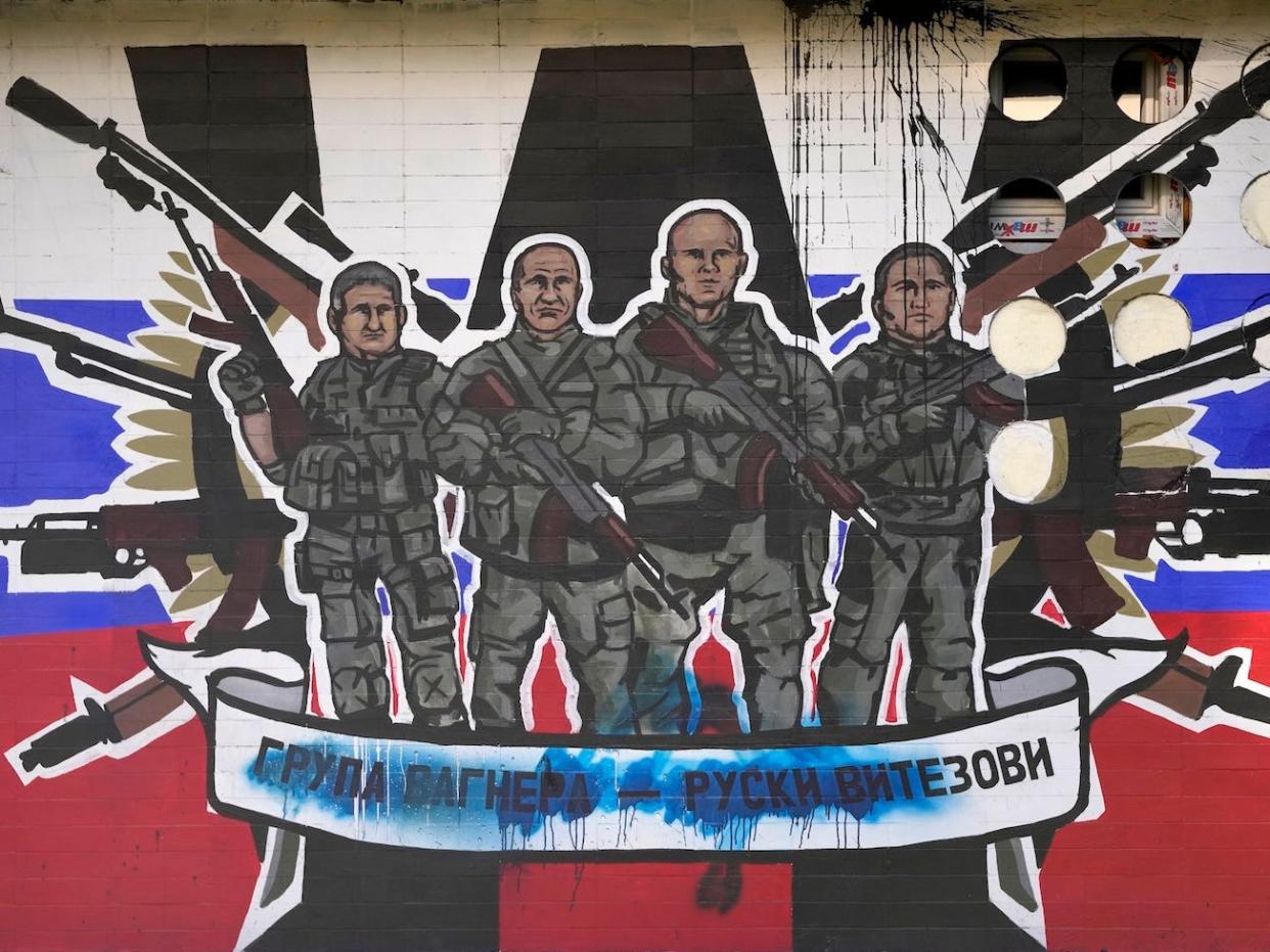 A mural depicting Russia's Wagner Group that reads: "Wagner Group - Russian knights."