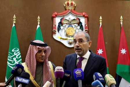 Jordanian Foreign Minister Ayman Safadi (R), and his Saudi counterpart Adel al-Jubeir speak to the media after their meeting n Amman, Jordan January 6, 2018. REUTERS/Muhammad Hamed