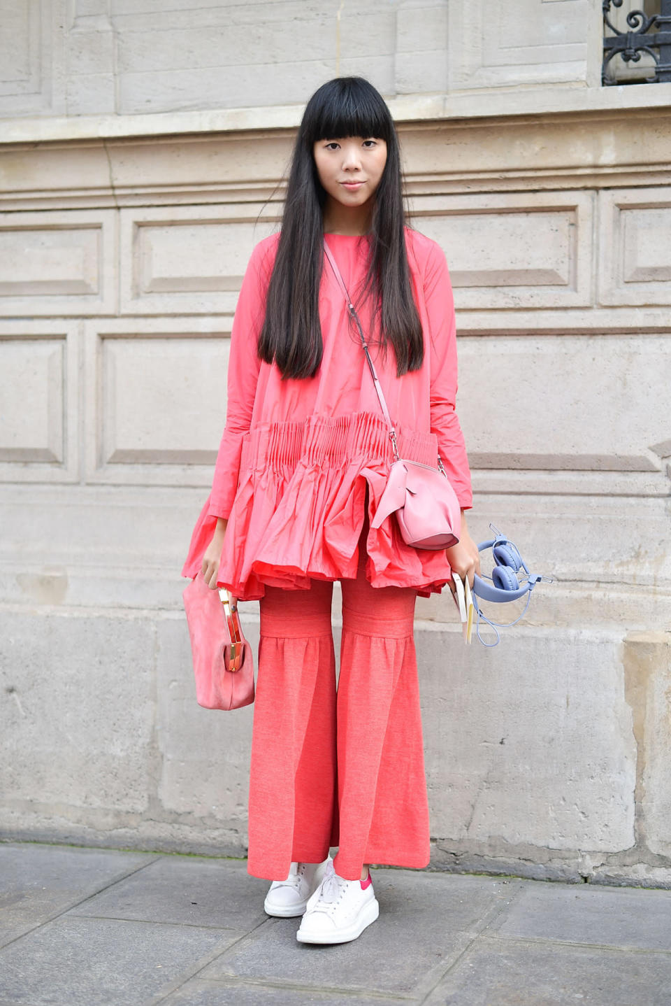 Susie Bubble in a salmon pink look with a Loewe elephant purse at the Chanel spring/summer 2016 haute couture show in Paris.