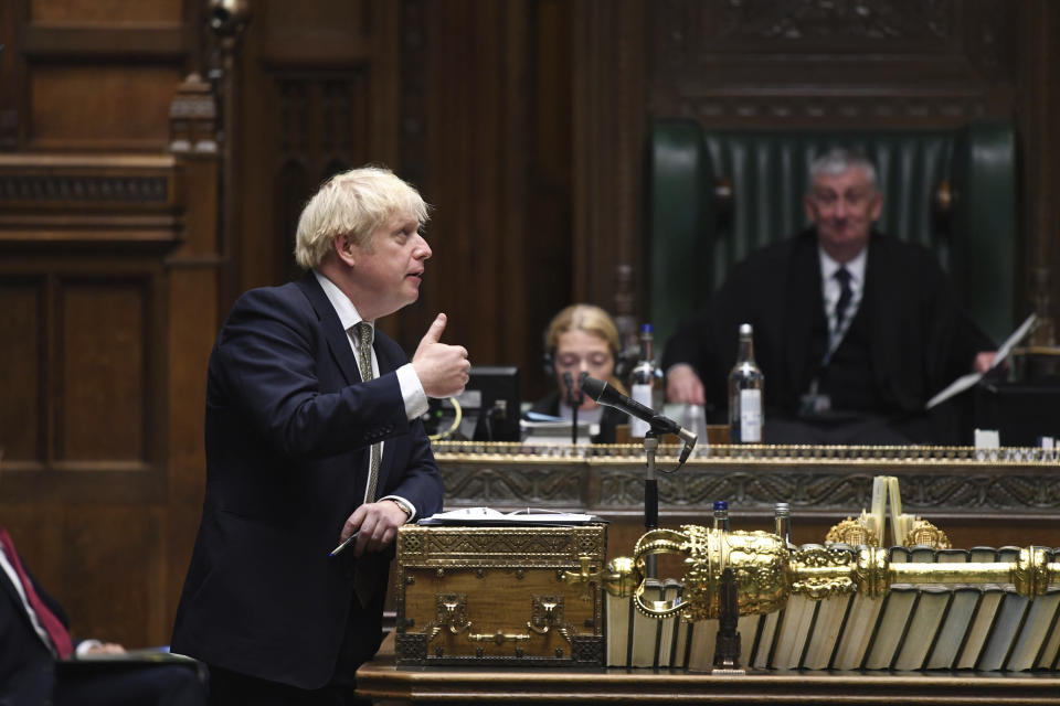 In this photo released by UK Parliament, Britain's Prime Minister Boris Johnson makes a statement in the House of Commons in London, Monday, Oct. 12, 2020. The British government has carved England into three tiers of risk in a bid to slow the spread of a resurgent coronavirus. The northern city of Liverpool is in the highest category and will close pubs, gyms and betting shops. (Jessica Taylor/UK Parliament via AP)