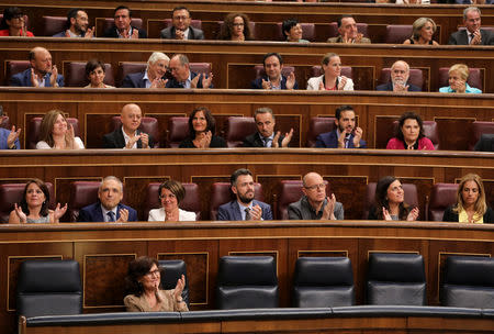 Socialist deputies applaud after winning the vote in parliament on the Socialist's government's plans to exhume the remains of former dictator Francisco Franco from the giant mausoleum at "The Valley of the Fallen", in Madrid, Spain, September 13, 2018. REUTERS/Sergio Perez