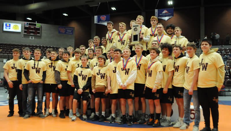 The Juab boys wrestling team holds up its eighth consecutive team wresting trophy Saturday, Feb. 17, 2024, at the Sevier Valley Center in Richfield.