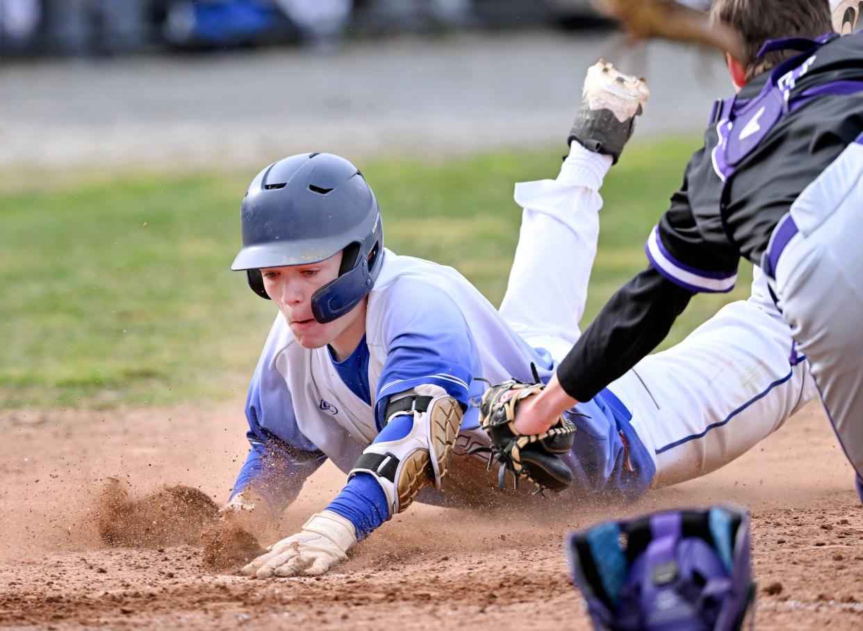 HYANNIS  04/18/22 Brady Meyer of St. John Paul II arrives home ahead of the tag by Pittsfield catcher Brandon Mazzeo.  Pittsfield won 16-6 in six innings.