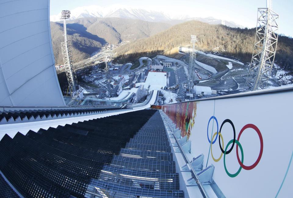 The photo taken with a fisheye lens show the start area on the large hill of the ski jumping stadium for the 2014 Winter Olympics, Tuesday, Feb. 4, 2014, in Krasnaya Polyana, Russia. (AP Photo/Dmitry Lovetsky)