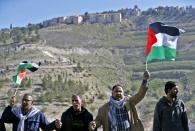 Palestinians protest against the construction of Jewish settlements in the occupied West Bank on January 20, 2017 near the Maale Adunium settlement, east of Jerusalem