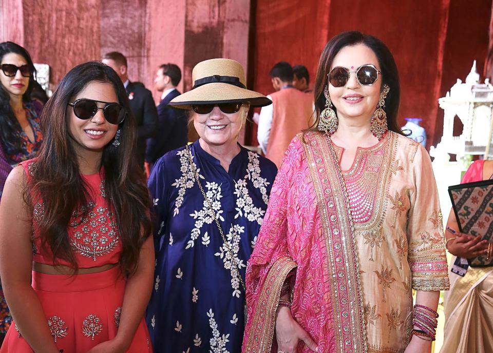 This handout photograph released on December 9, 2018 by Reliance Industries shows Reliance Industries chairman wife Nita Ambani (R), with her daughter Isha Ambani along with former US first lady Hillary Clinton (C) posing for a picture at Swadesh Bazaar in Udaipur. (Photo by Handout / Reliance Industries / AFP) / RESTRICTED TO EDITORIAL USE - MANDATORY CREDIT "AFP PHOTO / RELIANCE INDUSTRIES" - NO MARKETING NO ADVERTISING CAMPAIGNS - DISTRIBUTED AS A SERVICE TO CLIENTS --- NO ARCHIVE ---HANDOUT/AFP/Getty Images ORIG FILE ID: AFP_1BG76X