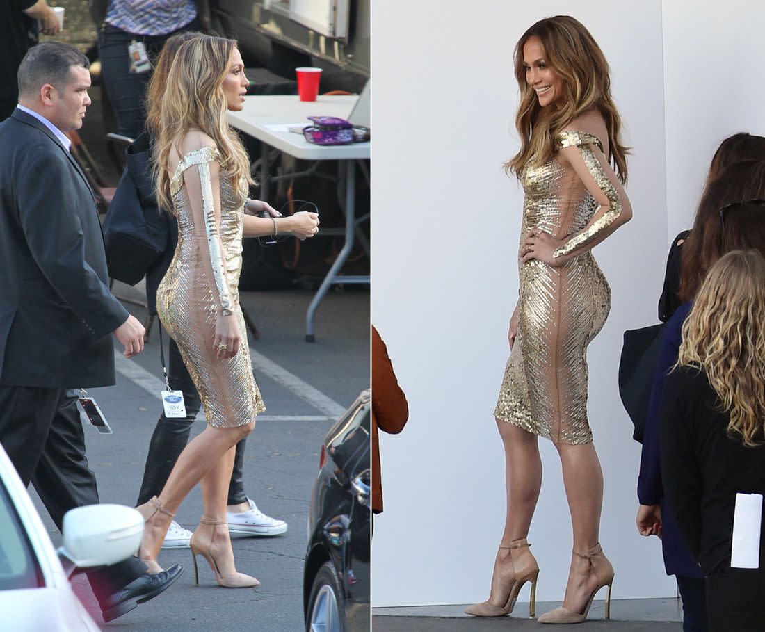 Jennifer Lopez is still Hollywood's reigning golden girl ... and she has the dress to prove it. The sultry singer showed off a tantalizing peek at her curves in a skin-tight metallic number on the set of "American Idol."