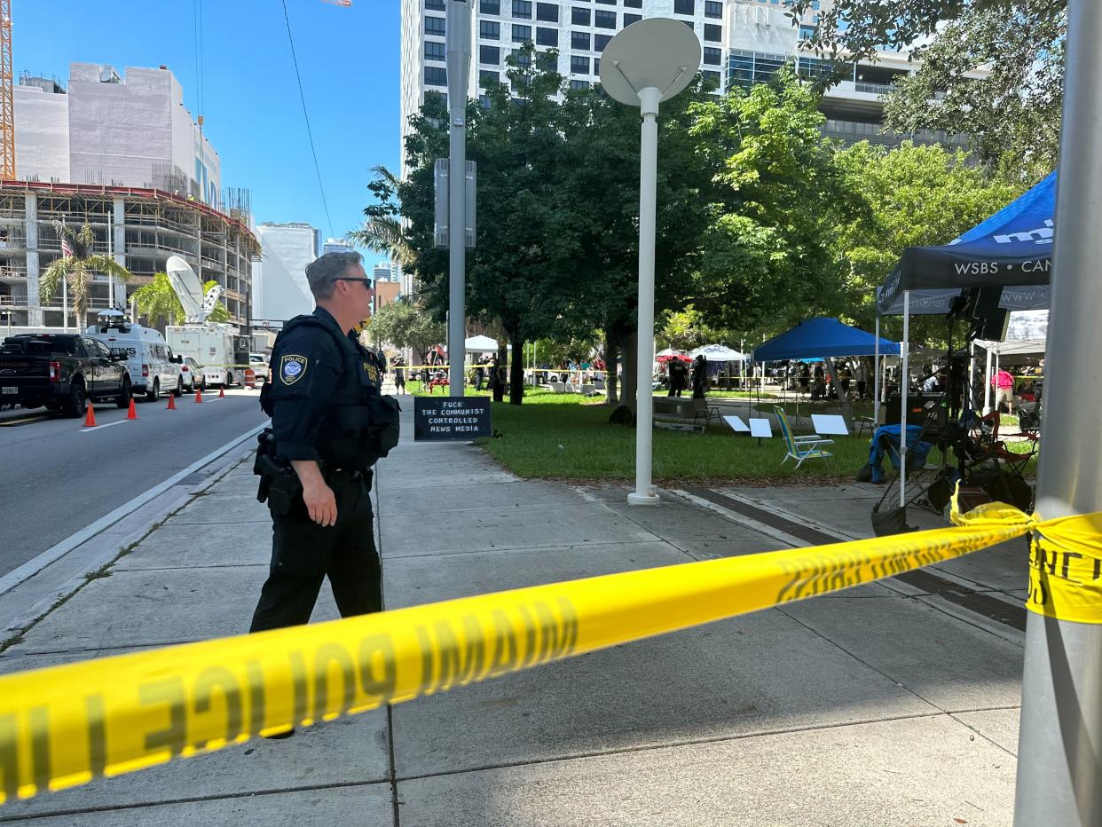 Police put tape up near an area in front of the courthouse where an unknown, but suspicious, object may be (Andrew Feinberg / The Independent)