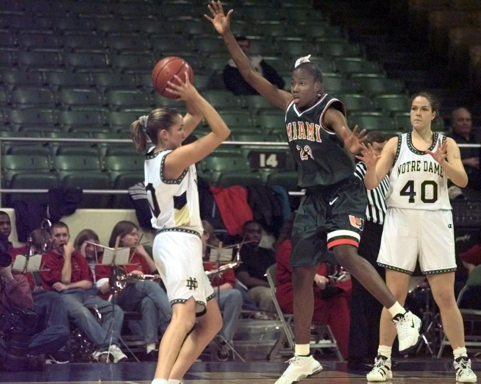 Notre Dame's Sheila McMillen, left, looks for an open teammate during her playing days with the Irish.