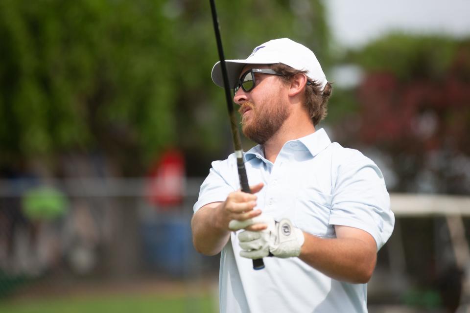 Washburn University alum Andrew Beckler practices a few drives Wednesday morning from Pure Golf Topeka as he begins preparations for his first U.S. Open appearance.
