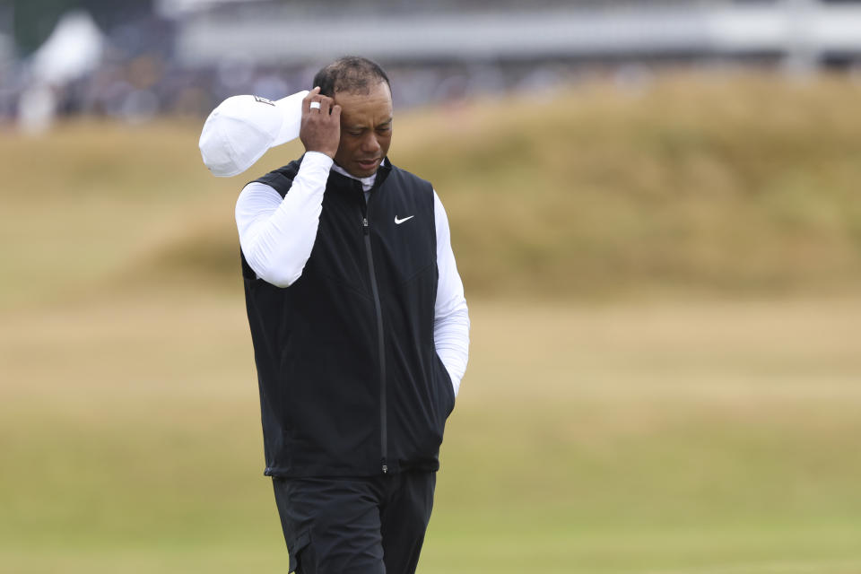 Tiger Woods of the US walks along the 3rd fairway during the second round of the British Open golf championship on the Old Course at St. Andrews, Scotland, Friday July 15, 2022. The Open Championship returns to the home of golf on July 14-17, 2022, to celebrate the 150th edition of the sport's oldest championship, which dates to 1860 and was first played at St. Andrews in 1873. (AP Photo/Peter Morrison)