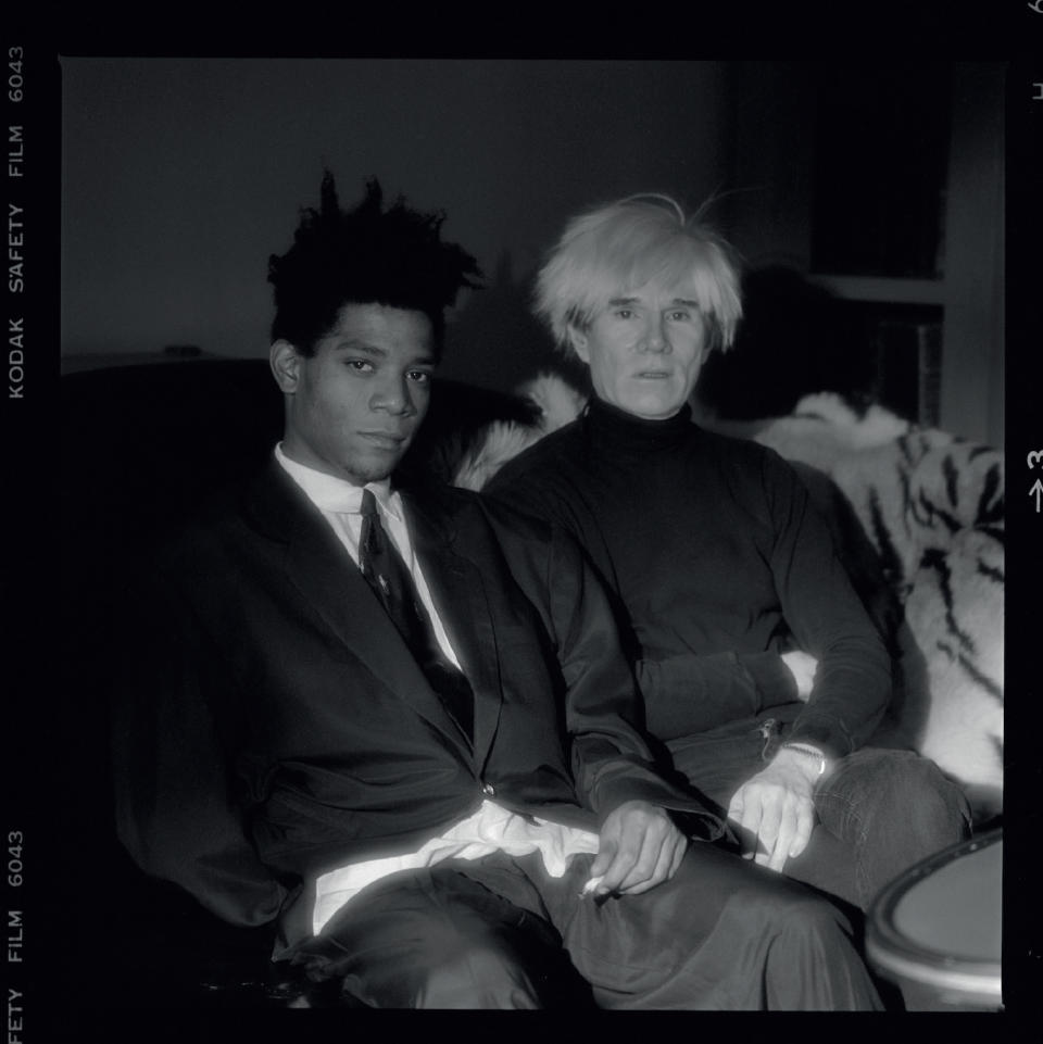 Jean-Michel Basquiat and <a href="https://wwd.com/fashion-news/fashion-scoops/hermes-permanent-injunction-metabirkin-nfts-1235572636/" rel="nofollow noopener" target="_blank" data-ylk="slk:Andy Warhol;elm:context_link;itc:0;sec:content-canvas" class="link ">Andy Warhol</a> at The Factory, photographed by Jeannette Montgomery Barron.