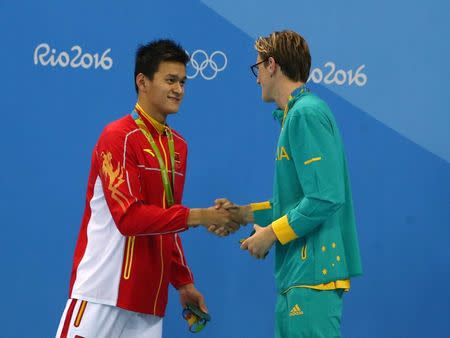 2016 Rio Olympics - Swimming - Victory Ceremony - Men's 400m Freestyle Victory Ceremony - Olympic Aquatics Stadium - Rio de Janeiro, Brazil - 06/08/2016. Gold medallist Mack Horton (AUS) of Australia shakes hands with silver medallist Sun Yang (CHN) of China (PRC). REUTERS/Marcos Brindicci