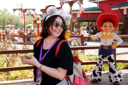 A woman visits the opening event of Disney-Pixar Toy Story Land, the seventh themed land in Shanghai Disneyland in Shanghai, China April 26, 2018. REUTERS/Aly Song