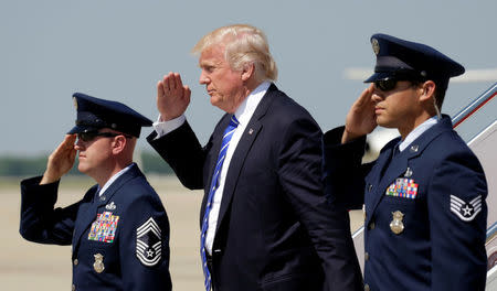 U.S. President Donald Trump salutes as he steps from Air Force One upon his arrival at Joint Base Andrews in Maryland, U.S., May 17, 2017. REUTERS/Kevin Lamarque