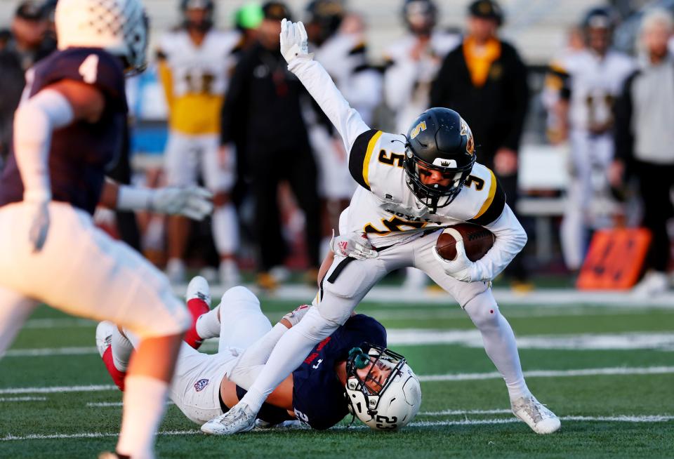 Woods Cross’ Isaac Johnson tries in vain to stop Roy’s Robert Young as they play at Woods Cross High School on Friday, Sept. 22, 2023. | Scott G Winterton, Deseret News