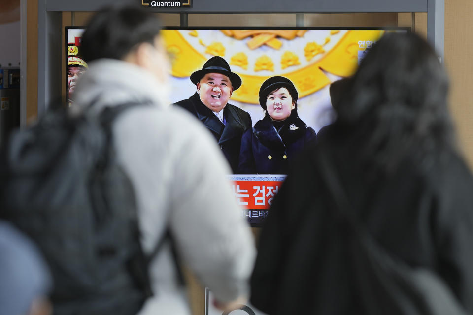 A TV screen shows an image of North Korean leader Kim Jong Un with his daughter during a news program at the Seoul Railway Station in Seoul, South Korea, Thursday, Feb. 9, 2023. Kim brought his young daughter to a huge military parade showing off the latest hardware of his fast-growing nuclear arsenal, including intercontinental ballistic missiles designed to reach the United States, state media said Thursday. (AP Photo/Lee Jin-man)