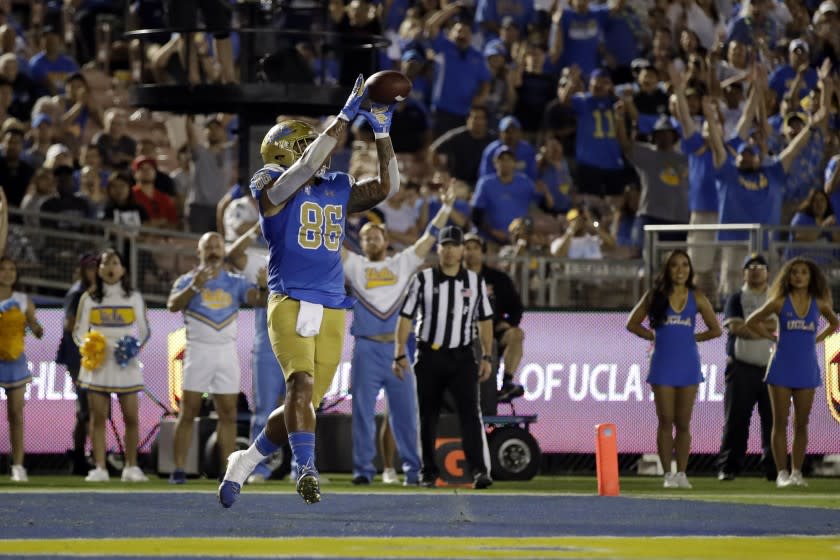 UCLA tight end Devin Asiasi (86) catches a touchdown pass during the second half of an NCAA college football game against Arizona State, Saturday, Oct. 26, 2019, in Pasadena, Calif. (AP Photo/Marcio Jose Sanchez)