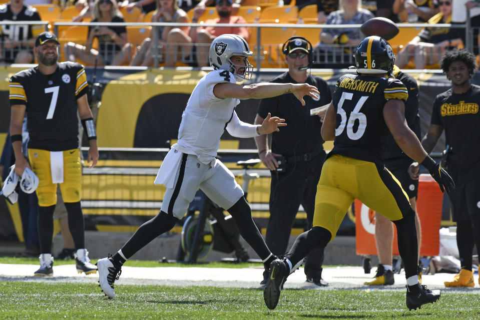 Las Vegas Raiders quarterback Derek Carr (4) gets off a pass under pressure by Pittsburgh Steelers linebacker Alex Highsmith (56) during the second half of an NFL football game in Pittsburgh, Sunday, Sept. 19, 2021. (AP Photo/Don Wright)
