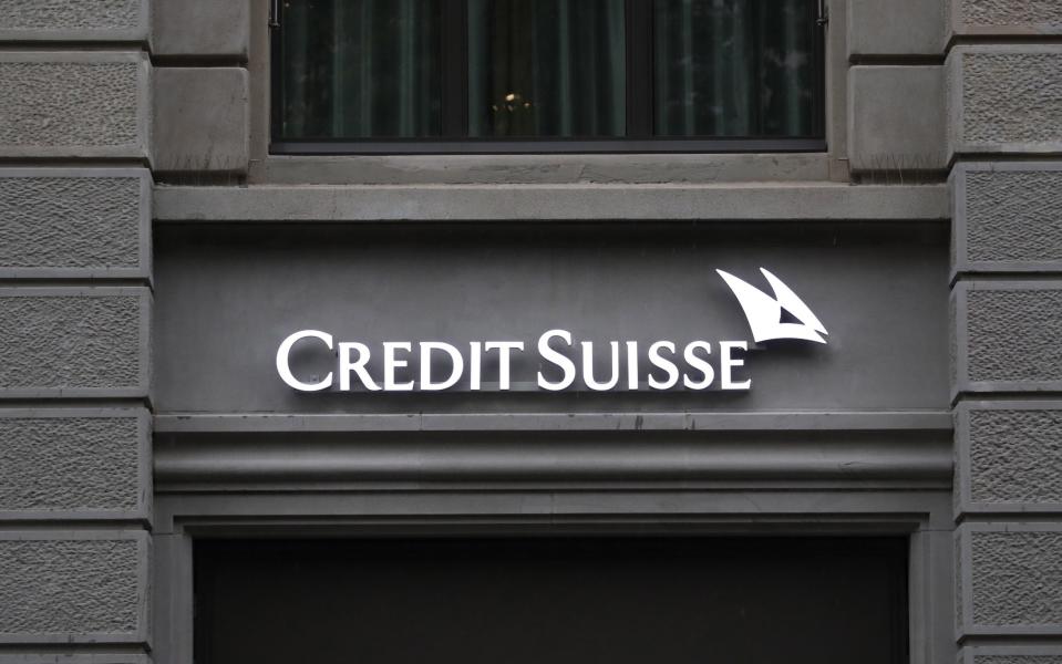 A sign on the facade of a Credit Suisse Group AG bank branch in Zurich, Switzerland