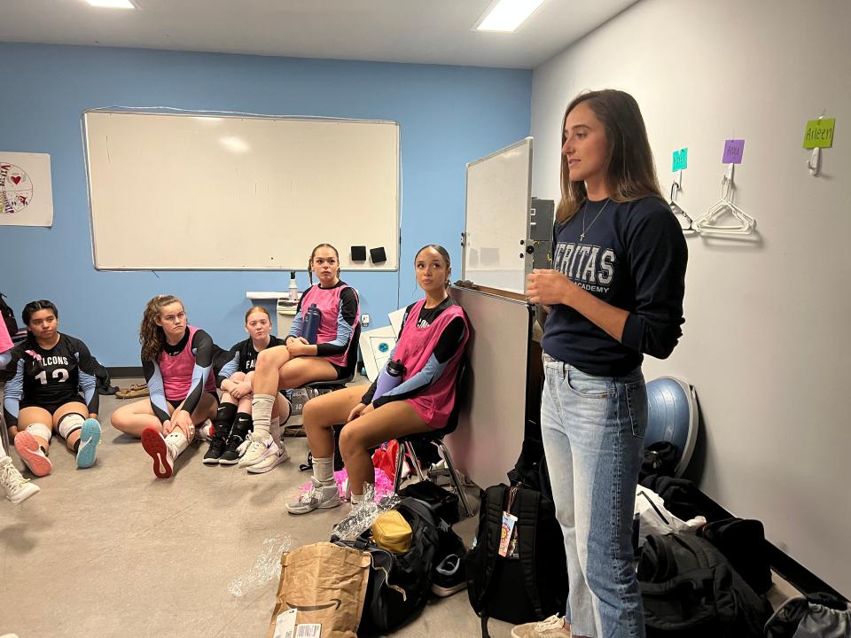 Beach volleyball Olympian Sarah Sponcil meets with members of the girls varsity volleyball team at Veritas Prep Academiy, where Sponcil starred on the volleyball team.