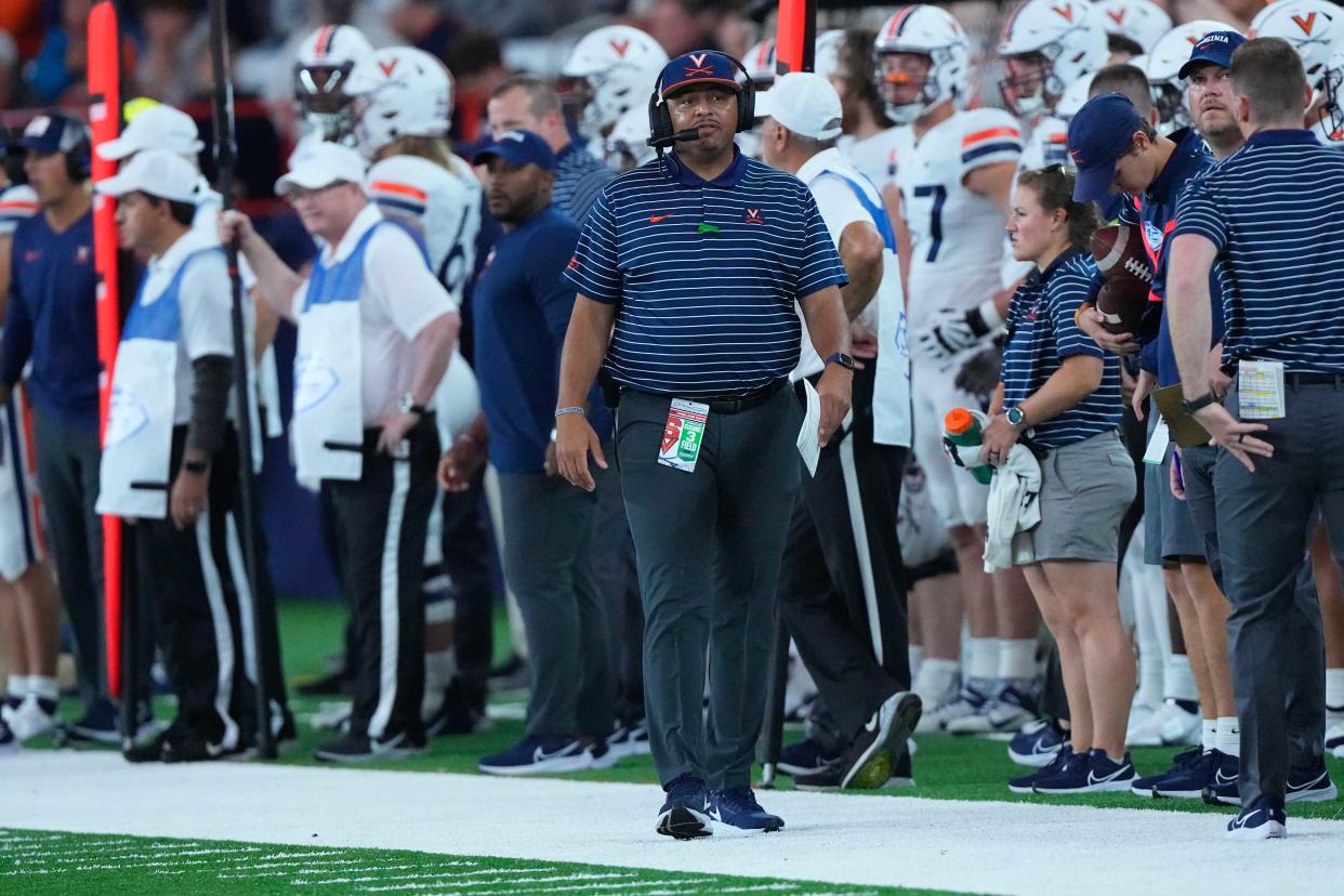 Virginia coach Tony Elliott looks on from the sidelines during the first half of his team's game against Syracuse at JMA Wireless Dome.