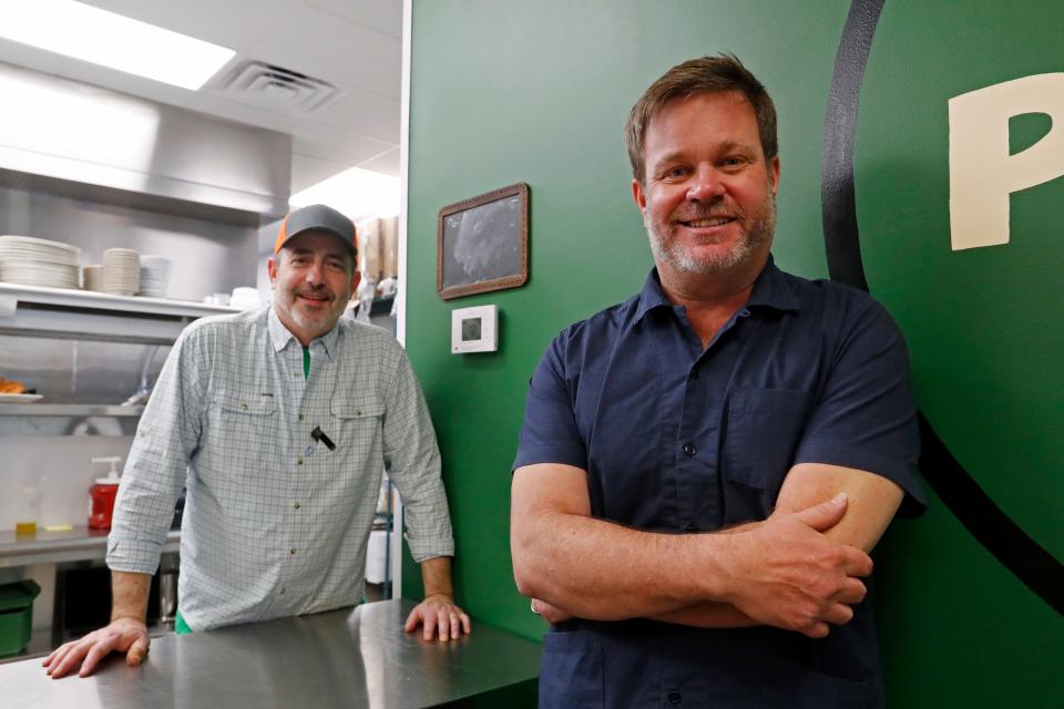 Chef Ted Lahey, left, and owner Paul Allen pose for a photo inside of Preacher Green's on Barnett Shoals Road in Athens, Ga., on Friday, April 5, 2024. Their restaurant opened this week and offers a verity of sandwiches and salads for lunch and classic southern meat and three style dinner options.