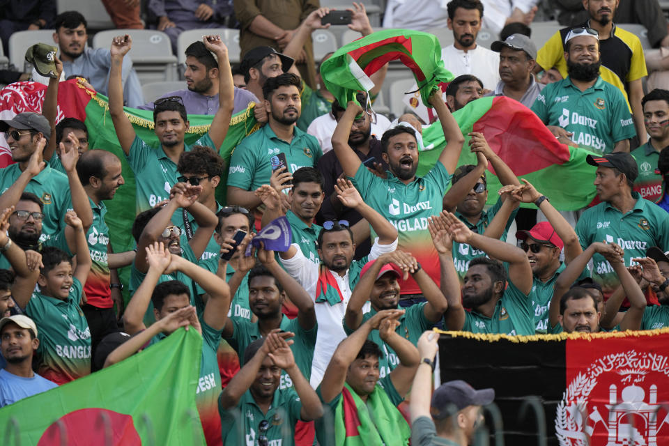 Bangladesh cricket fans cheer during the Asia Cup cricket match between Bangladesh and Afghanistan in Lahore, Pakistan, Sunday, Sept. 3, 2023. (AP Photo/K.M. Chaudary)