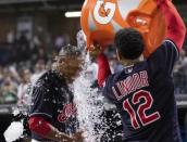 Sep 23, 2018; Cleveland, OH, USA; Cleveland Indians shortstop Francisco Lindor (12) pours water on centerfielder Greg Allen following his eleventh inning walk-off hit against the Boston Red Sox at Progressive Field. Mandatory Credit: Scott R. Galvin-USA TODAY Sports