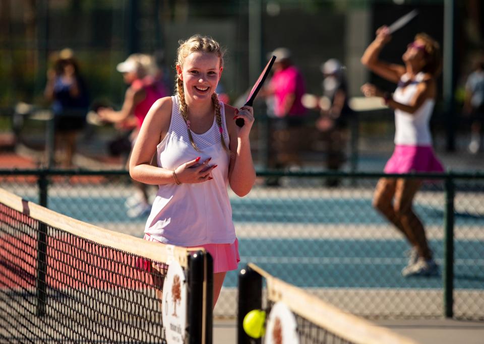 Xavier Prep tennis player Hailey Goldstein, 16, smiles as she runs to retrieve a ball during the Pink Pickleball Charity Tournament at Mission Hills Country Club in Rancho Mirage, Calif., Saturday, Nov. 18, 2023.