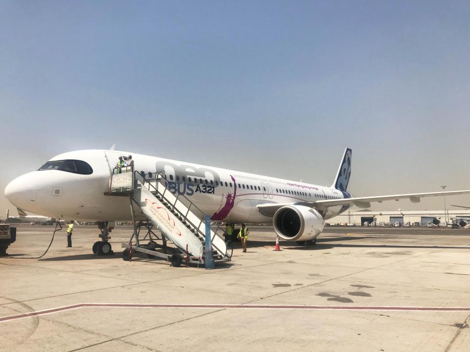 A parked Airbus A321LR, with airstairs attached