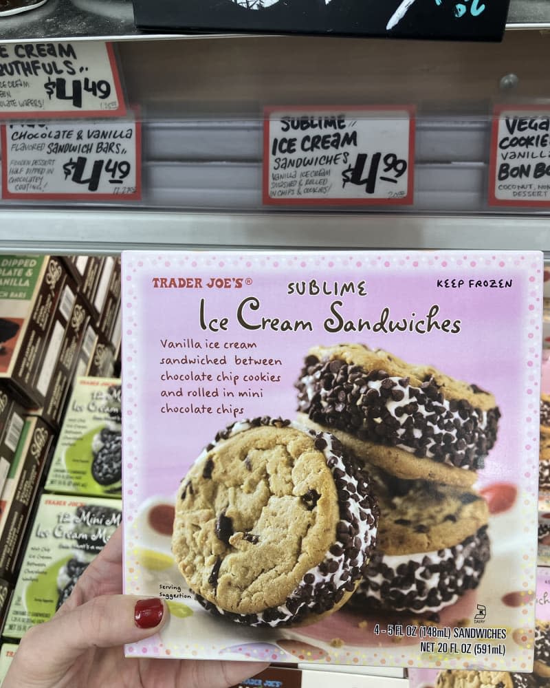 someone holding Sublime Ice Cream Sandwiches at Trader Joe's store