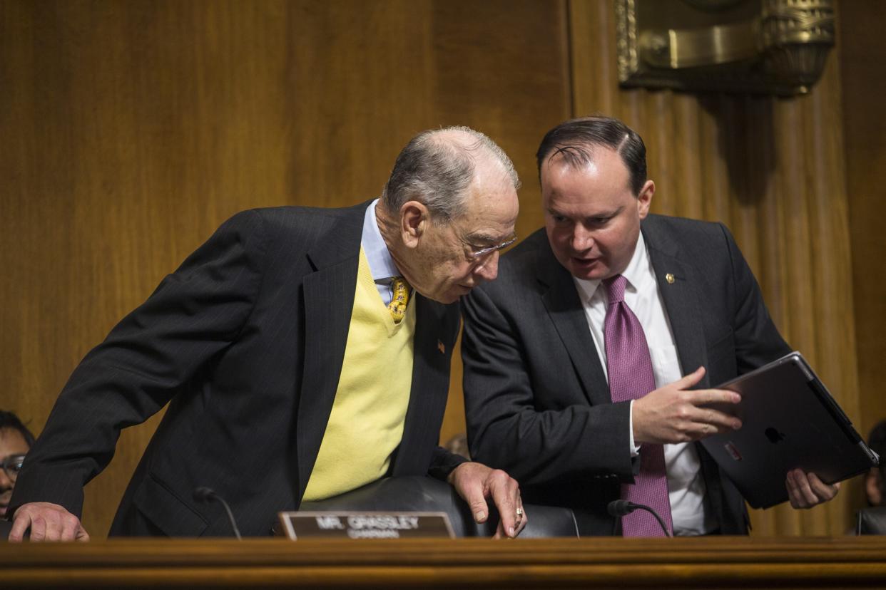 Sen. Mike Lee, R-Utah, speaks to Senate Judiciary Committee Chairman Sen. Chuck Grassley, R-Iowa, during a Senate Judiciary Committee hearing on December 11, 2018 in Washington, D.C. Lee and Grassley have been working to get a criminal justice reform bill over the finish line.