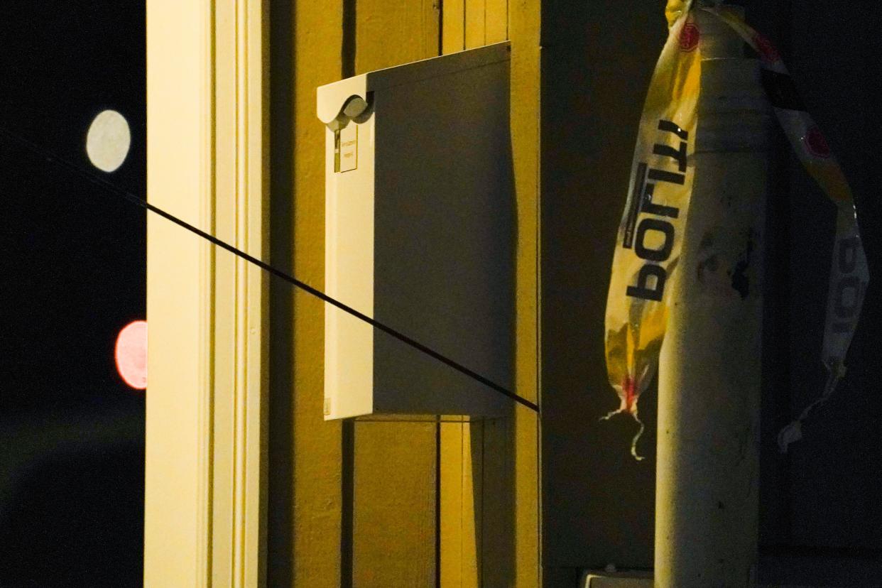 An arrow is seen in the wall after an attack in Kongsberg, Norway, Wednesday, Oct. 13, 2021. Several people have been killed and others injured by a man armed with a bow and arrow in a town west of the Norwegian capital, Oslo. 
