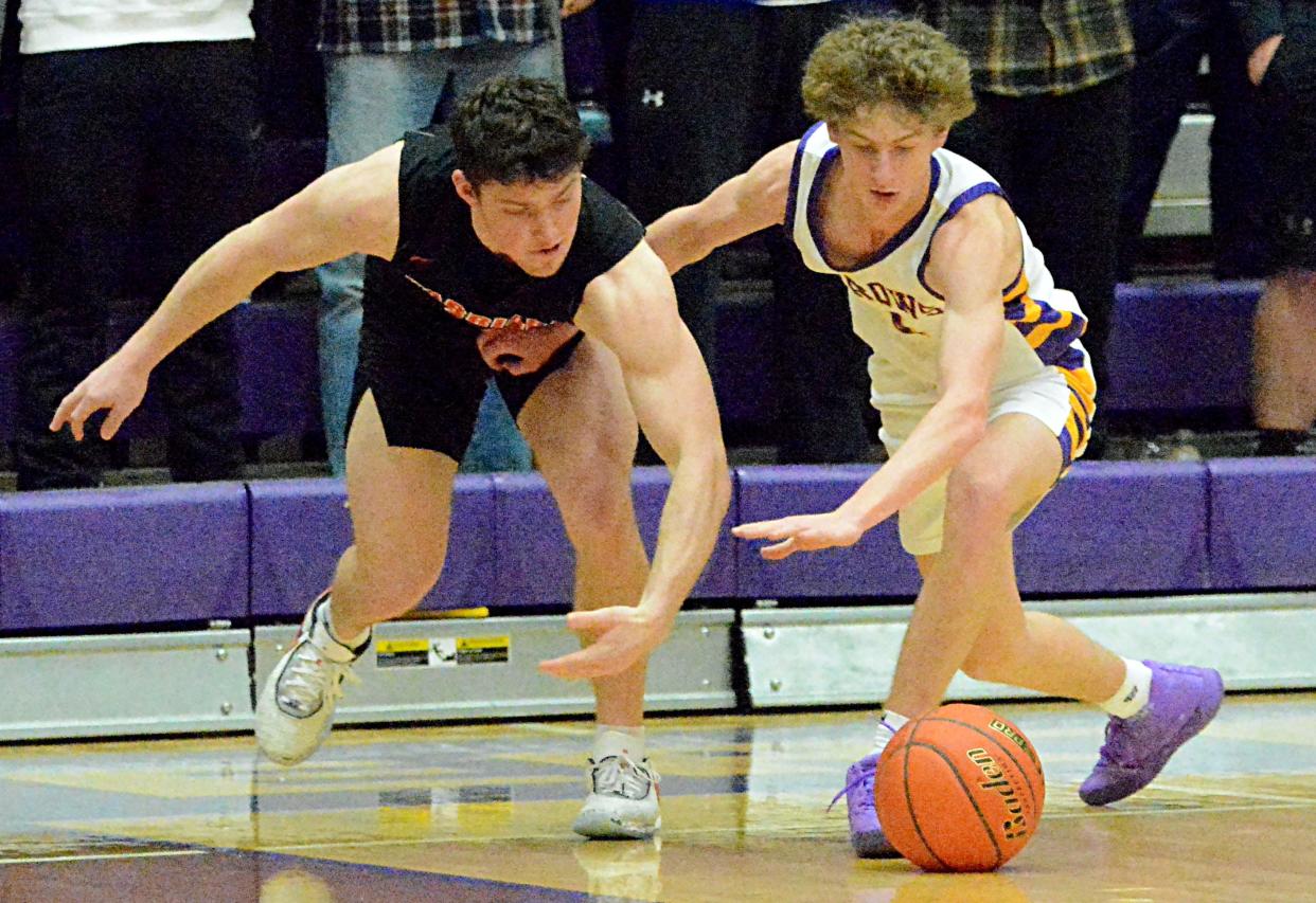 Watertown's Dylon Rawdon (right) and Sioux Falls Washington's Tryg Auten battle for a loose ball during a high school boys basketball game on Friday, Feb. 3, 2023 in the Watertown Civic Arena.