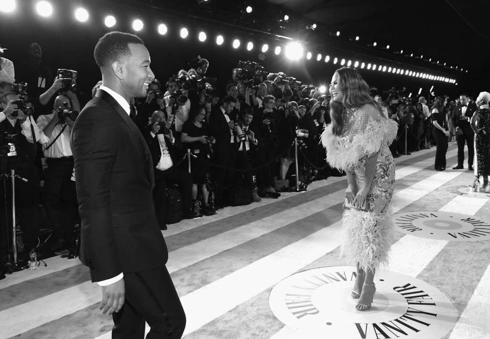 John Legend (L) and Chrissy Teigen attend the 2019 Vanity Fair Oscar Party hosted by Radhika Jones at Wallis Annenberg Center for the Performing Arts on February 24, 2019 in Beverly Hills, Californi