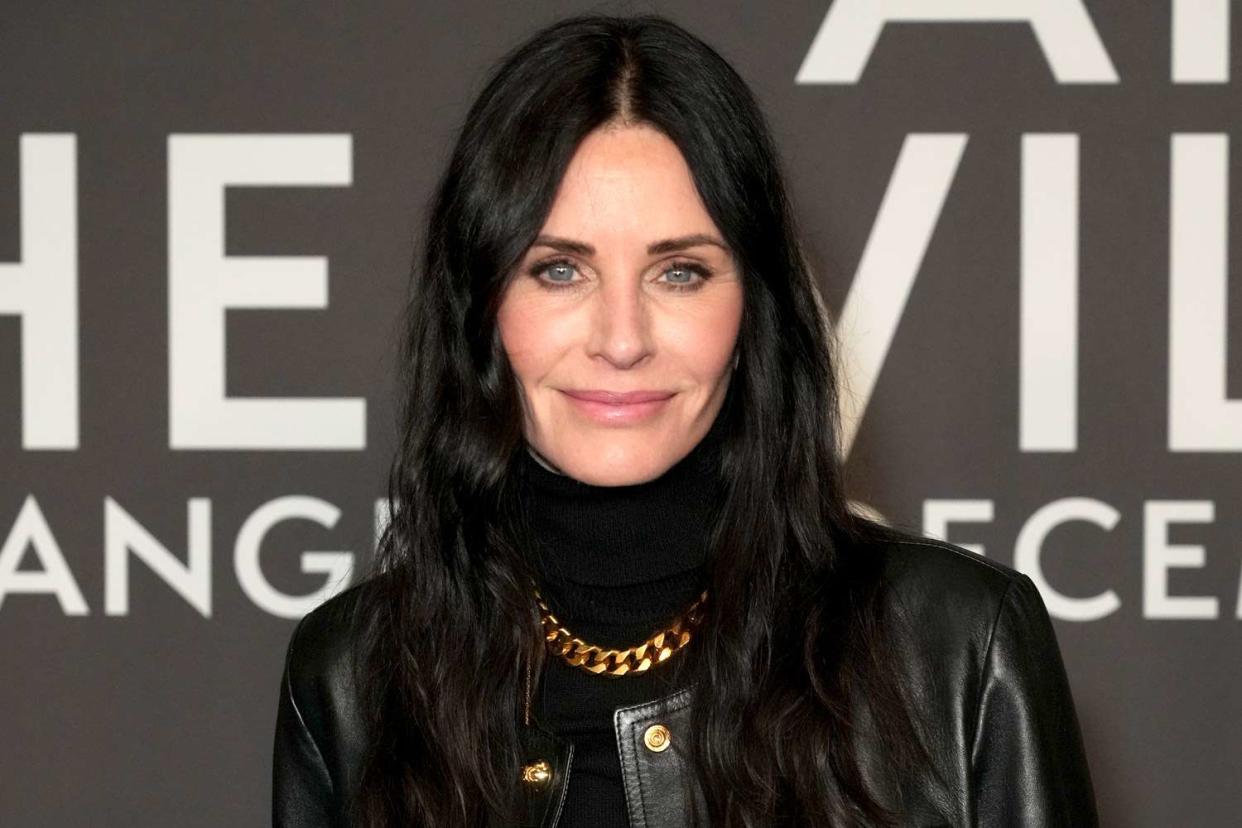 <p>Kevin Mazur/Getty</p> Courteney Cox attends Celine at The Wiltern on December 8, 2022 in Los Angeles, California.