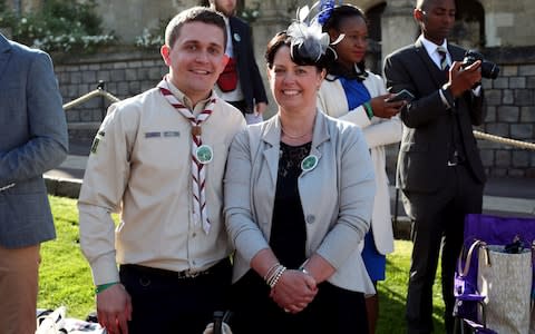 Scout leader Tom Moss (L) and mother Vickie (R) pose as they arrive for the wedding ceremony  - Credit: CHRIS RADBURN /AFP