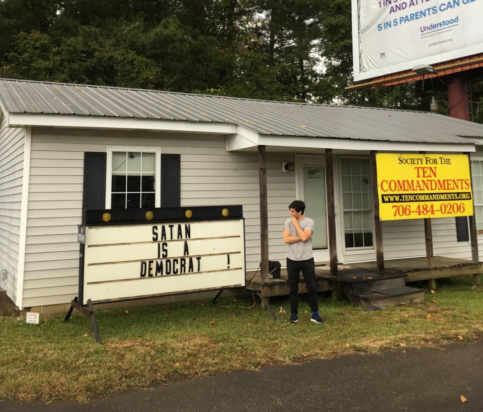 Plaut scrutinizing a local church sign in Milledgeville, Georgia, in September 2018. (Photo: Courtesy of Katie Anania)