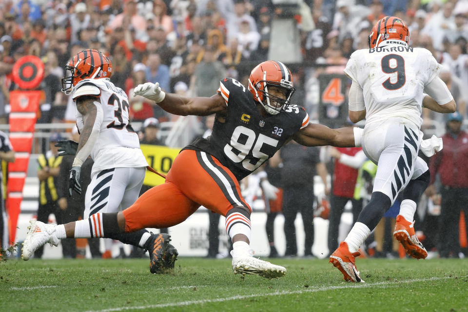 FILE - Cleveland Browns defensive end Myles Garrett (95) sacks Cincinnati Bengals quarterback Joe Burrow (9) during an NFL football game, Sunday, Sep. 10, 2023, in Cleveland. Garrett is a finalist for The Associated Press 2023 Defensive Player of the Year.(AP Photo/Kirk Irwin)