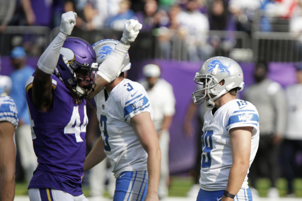 Detroit Lions place kicker Austin Seibert, right, reacts in front of Minnesota Vikings safety Josh Metellus (44) after missing a field goal during the second half of an NFL football game, Sunday, Sept. 25, 2022, in Minneapolis. The Vikings won 28-24. (AP Photo/Andy Clayton-King)