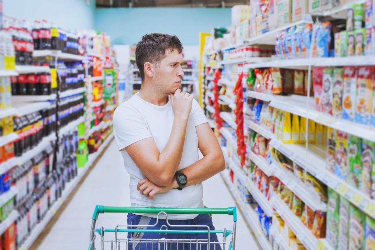 <a href="https://www.shutterstock.com/image-photo/thoughtful-man-grocery-store-customer-thinking-531012568" rel="nofollow noopener" target="_blank" data-ylk="slk:Shutterstock / Song_about_summer;elm:context_link;itc:0;sec:content-canvas" class="link ">Shutterstock / Song_about_summer</a>